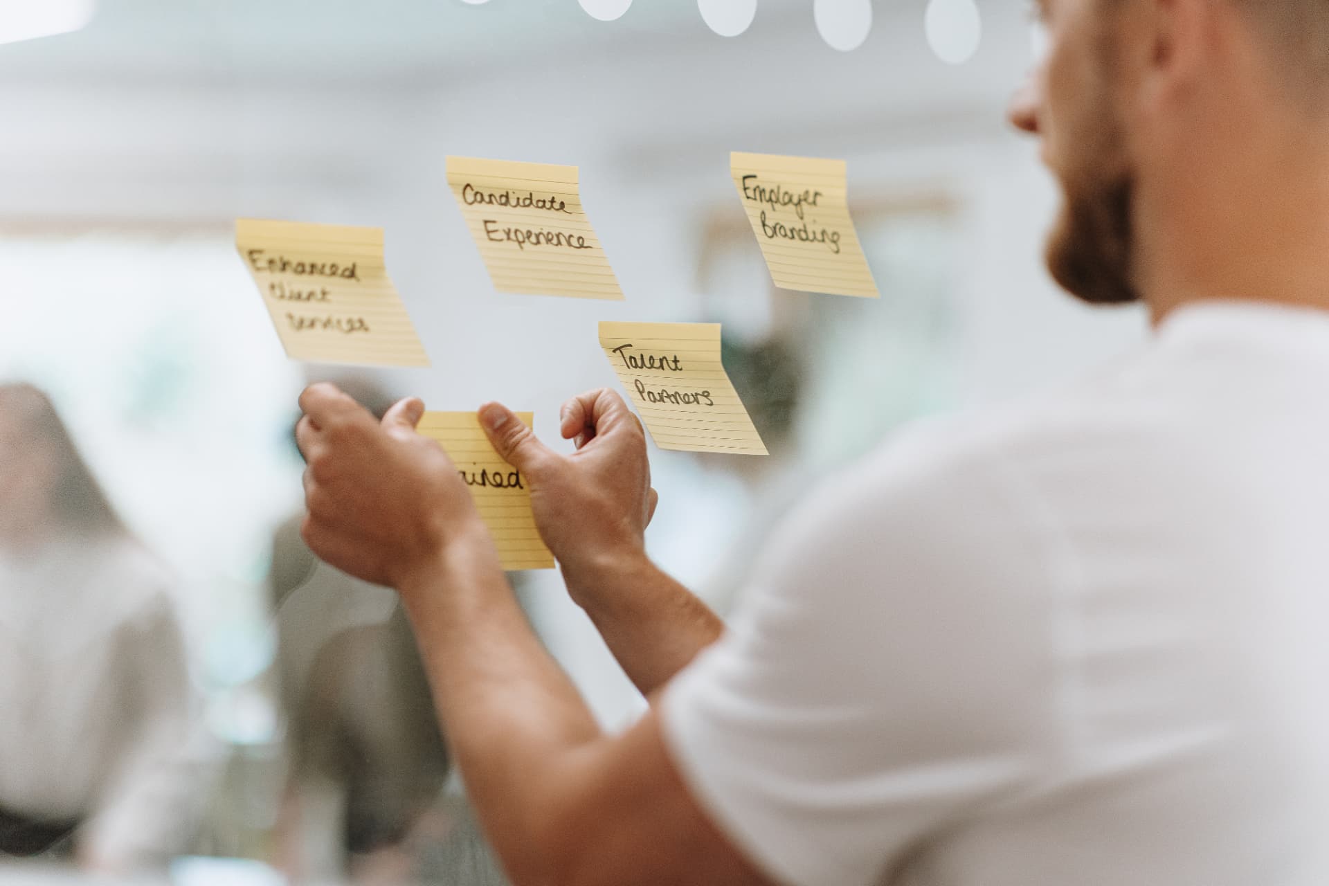 A Konker consultant mapping talent priorities on sticky notes